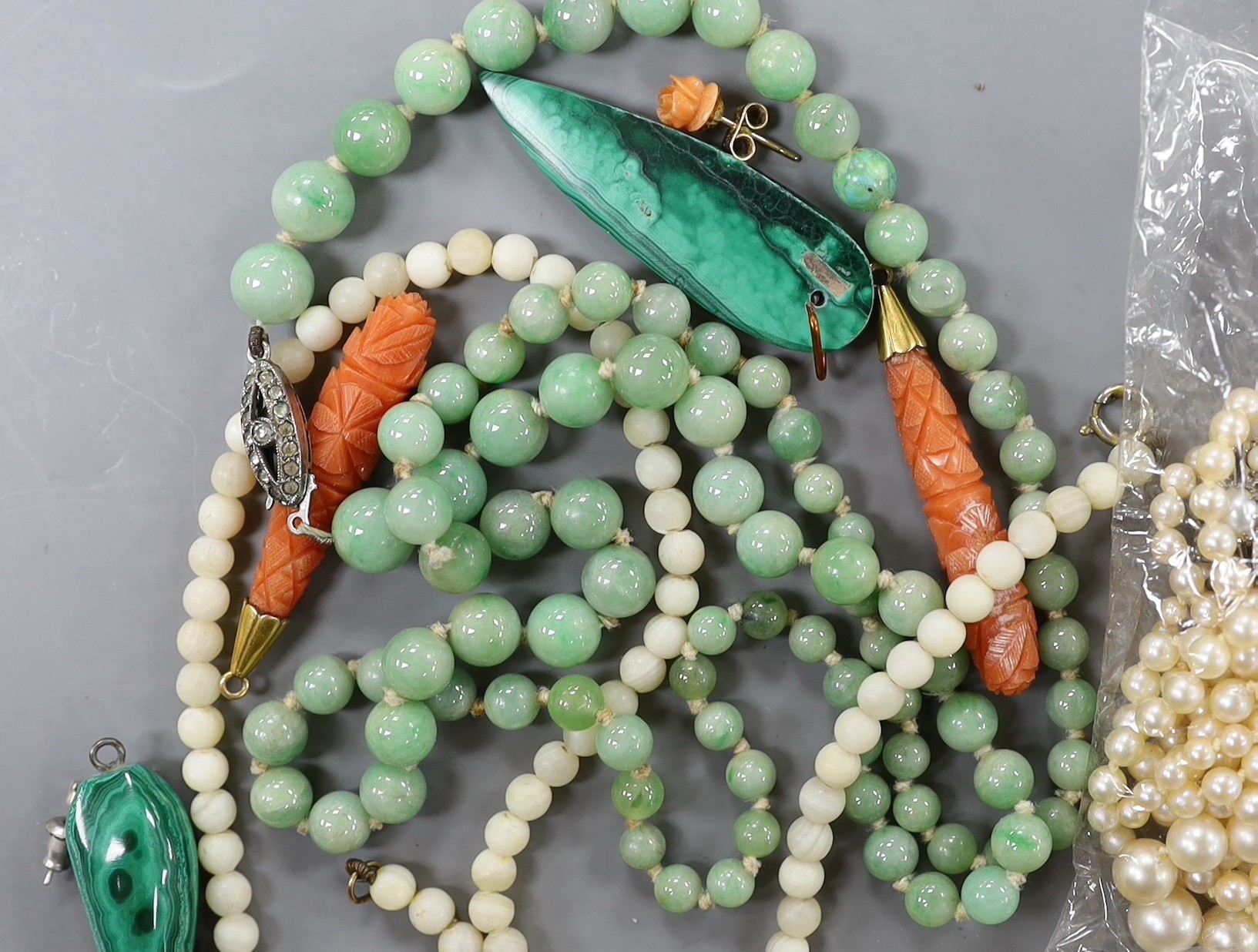 Assorted jewellery including cultured pearl necklace, jadeite bead necklace, marcasite set butterfly brooch, pair of carved coral earrings etc.